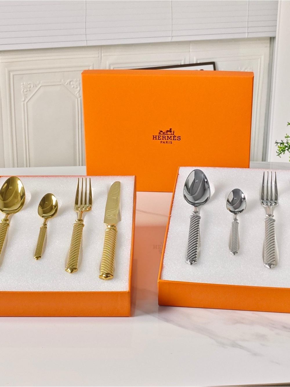 Hermes Gold and Silver Twisted-Handle Flatware Set